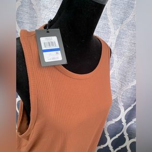 Accentuated with ribbed texture throughout, this dress is 100% cotton.